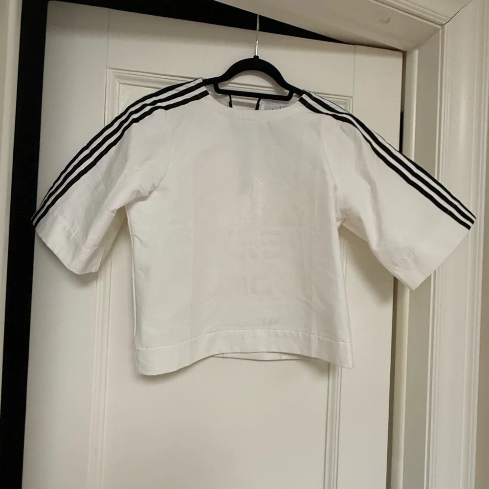 adidas woman’s White Top with Black Stripes - Picture 1 of 3